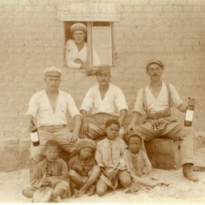 Namibia SWA Kaokoveld Soldiers Drinking and local Boys